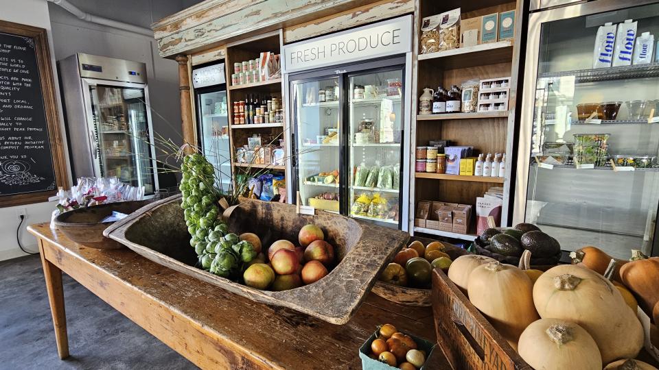 A still shot of fruit and vegetables on a store table for display