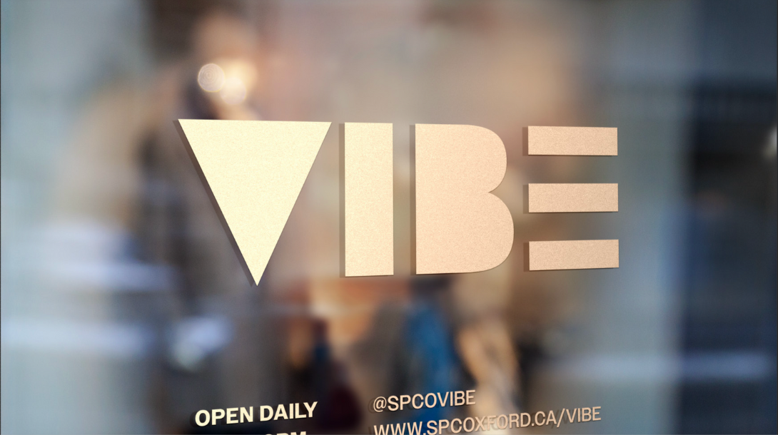 A blurred window with the Vibe logo in a frosted colour in the middle of the window. 