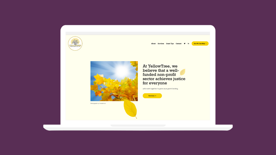 A laptop showcasing the front page of YellowTree's new website