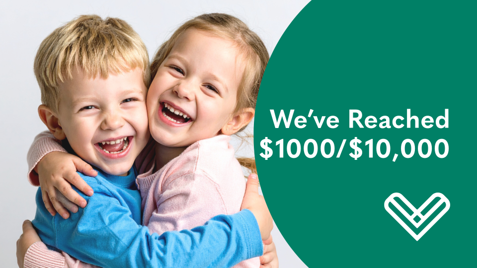 Two kids hugging with a financial goal of $1000/10000 reached