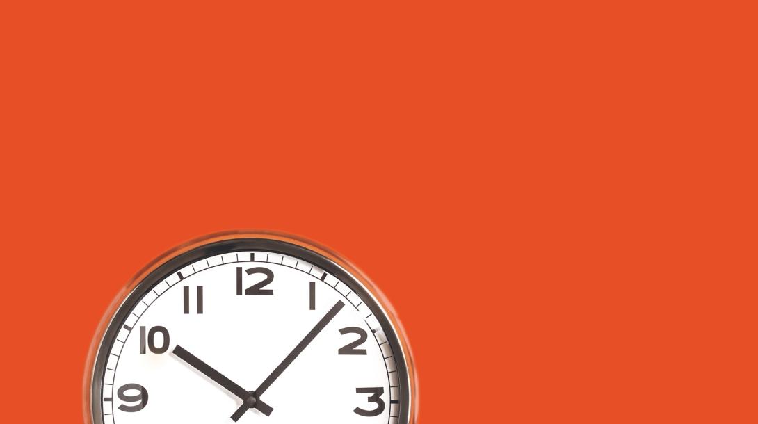 clock on an orange wall