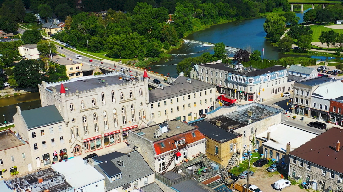 Aerial shot of the town of St. Marys featuring buildings, streets, and the water.
