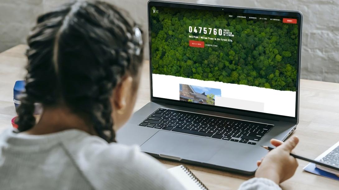Young person using Million Trees Campaign on their laptop