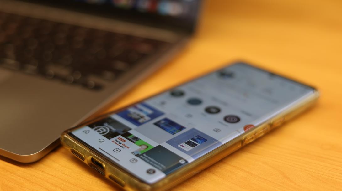 rTraction instagram profile page seen on a mobile phone on a desk.