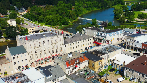Aerial shot of the town of St. Marys featuring buildings, streets, and the water.