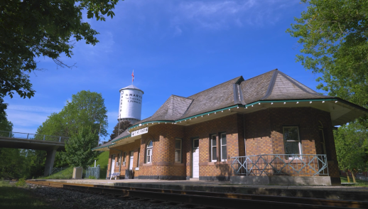 The town of St. Marys water tower behind the train station.